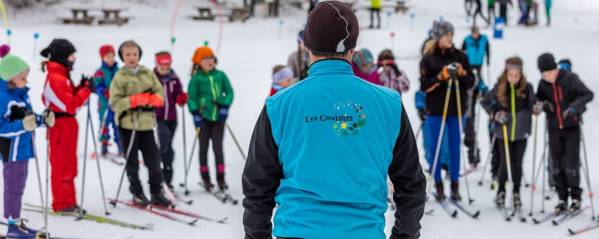 Instructor leading a group of cross-country skiers at the Coulmes resort